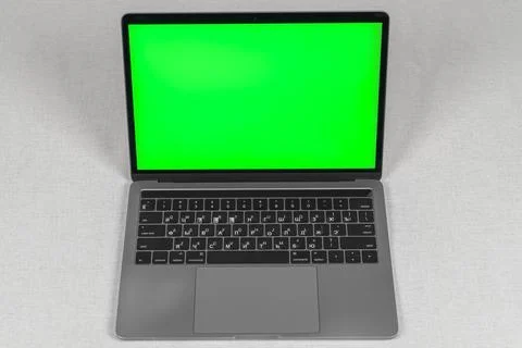 Opened laptop with green screen isolated Stock Photos