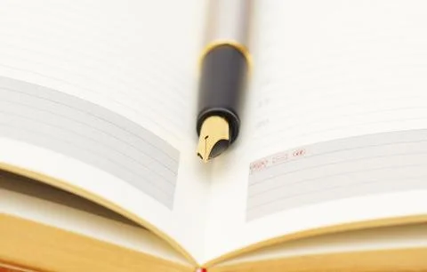 Opened lined diary Stock Photos