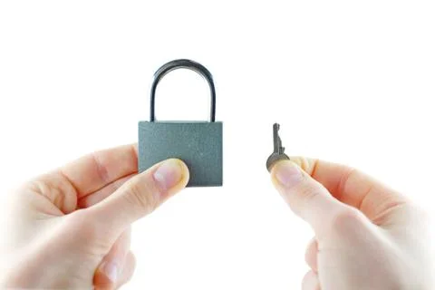Opened lock and key in hand Stock Photos