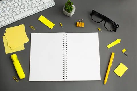 Opened notebook and other office equipment such as computer keyboard, Foto stock