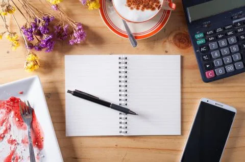 Opened notebook background on wood table Stock Photos
