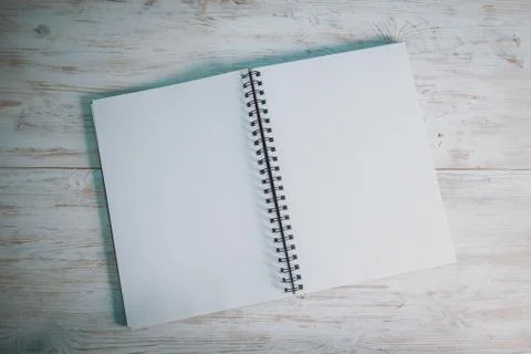 Opened notebook on the desk Stock Photos