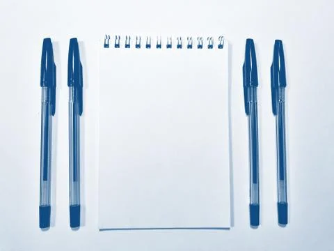 Opened notebook paper with pen. PANTONE Blue, Classic Blue, Phantom Blue Stock Photos