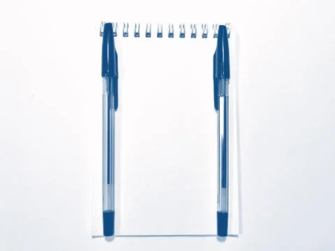 Opened notebook paper with pen. PANTONE Blue, Classic Blue, Phantom Blue Stock Photos