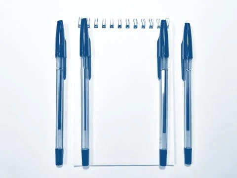 Opened notebook paper with pen. PANTONE Blue, Classic Blue, Phantom Blue Stock Photos
