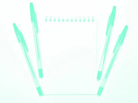 Opened notebook paper with pen on white desk, copy space. Aqua Menthe Stock Photos