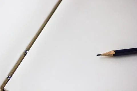 Opened notebook with pencil background with copy space. Black pencil on opene Stock Photos