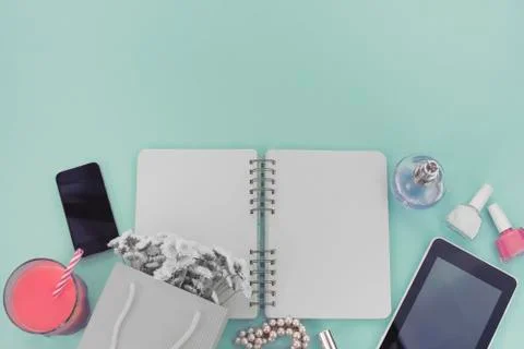 The opened notebook for records lies on the surface of the cocktail pink glas Stock Photos