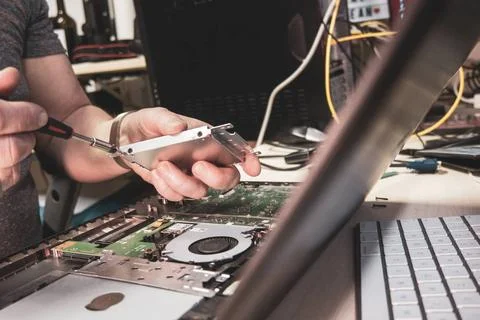 An opened notebook is repaired in a computer workshop Stock Photos