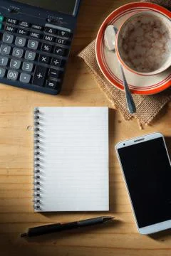 Opened notebook on wood table Stock Photos