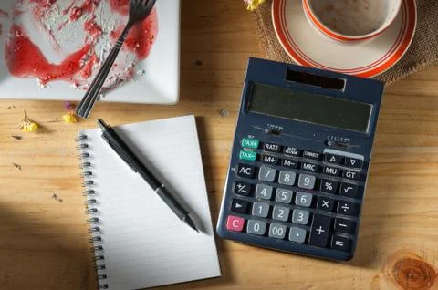 Opened notebook on wood table Stock Photos