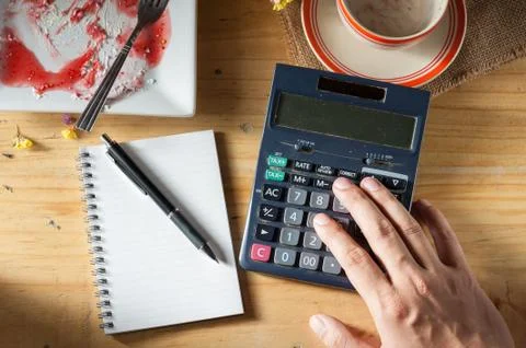 Opened notebook on wood table Stock Photos