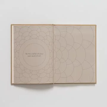 Opened notebook with a written text on a white surface 写真素材