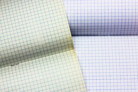 Opened notepad notebook with checkered sheets. Blank sheet in a cage. School. Stock Photos