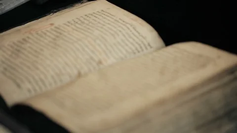 Opened old book in library Video stock 75425764