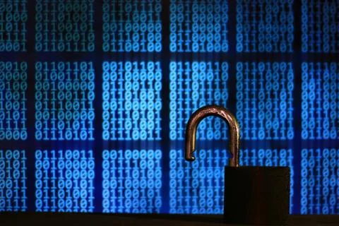 Opened padlock in front of binary code blocks background. cyberspace computer Stock Photos