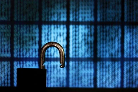 Opened padlock in front of binary code blocks background. cyberspace computer Stock Photos