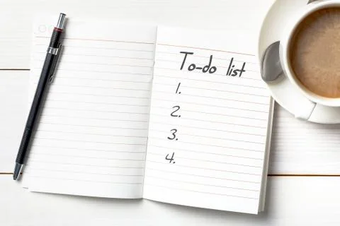 Opened personal organizer with a to do list. on white wooden background Stock Photos