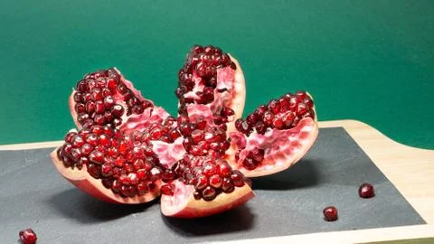 Opened pomegranate fruit in which the grains are visible, pomegranate is loca Stock Photos