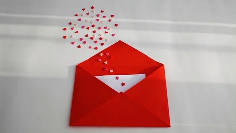 Opened red envelope and many felt hearts Stock Footage 125725826