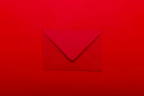 Opened red envelope. Blank envelope on dark red background. Stock Photos