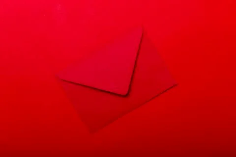 Opened red envelope. Blank envelope on dark red background. Stock Photos