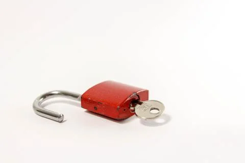 Opened red padlock and key Stock Photos