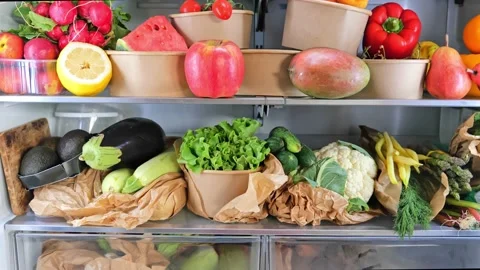 Opened refrigerator full of vegetarian healthy fruit, vegetables in zero waste b Stock Footage 196445754