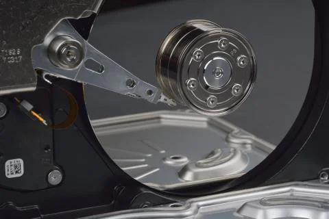 Opened SATA hard drive, on dark background Stock Photos