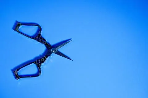 Opened scissors with decorative handle Photos