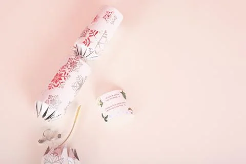 Opened silver christmas cracker with riddle in it Stock Photos