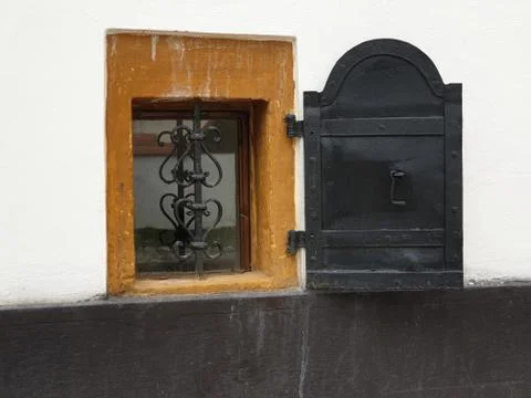 Opened small metallic shutter of basement window Stock Photos