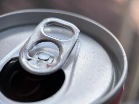 Opened soda can tab with blurred background Stock Photos