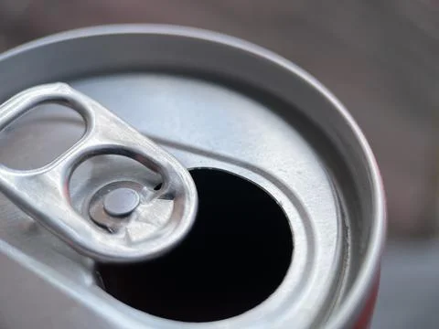 Opened soda can tab with blurred background Stock Photos
