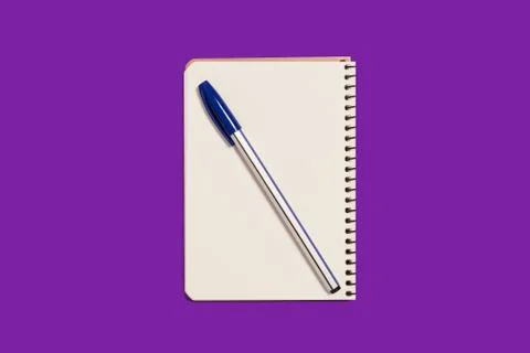 Opened spiral notebook with a pen Stock Photos
