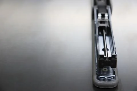 Opened stapler machine on the table Stock Photos