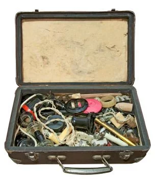 Opened suitcase with old electrical accessories Stock Photos