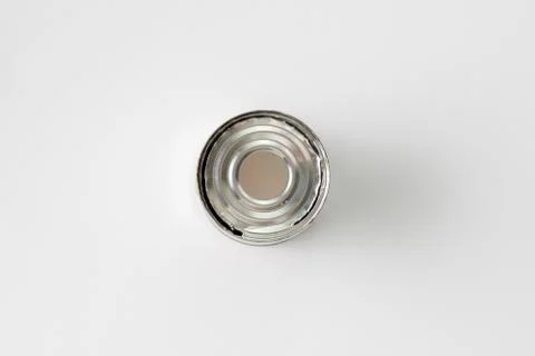 Opened tin can on the table without leftovers from the food, meal concervatio 스톡 사진