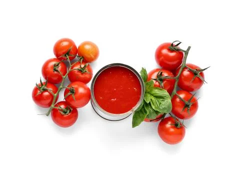 Opened tin can with tomato paste and ingredients isolated on white background Stock Photos