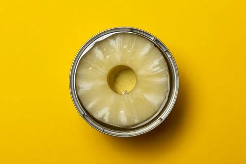 Opened Tinned pineapple slices in a can Stock Photos
