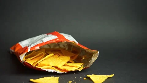 Opened Tortilla Chips Pack Falling Down On Black Background Stock Footage 243433967