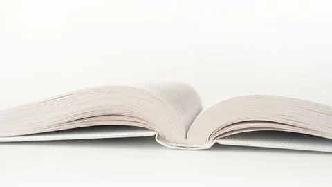 Opened white book on white background Stock Photos