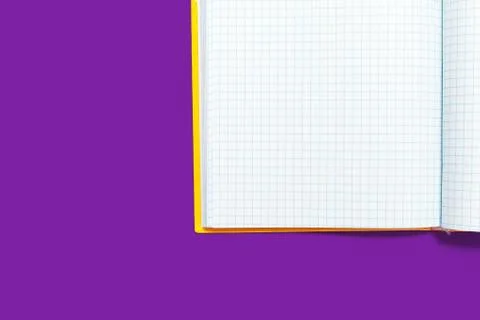 Opened workbook on a purple background Stock Photos