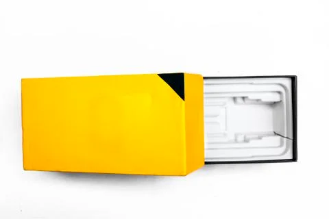 Opened Yellow and black colored glossy package, parcel, mobile, wrapping box  Stock Photos