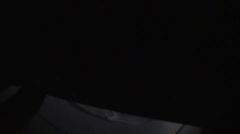 Opening airplane window shade at sunset in flight Video stock 67193873