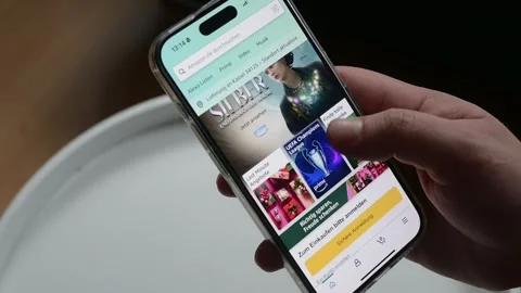 Opening the Amazon App on iPhone Stock Footage 258266058