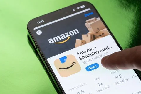 Opening Amazon app on smartphone Stock Photos