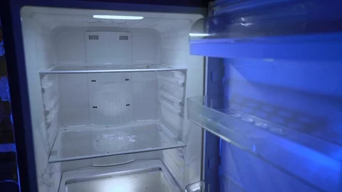 Opening and closing the door of an empty fridge. Nothing to eat. 스톡 동영상 123950896
