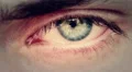 opening and closing of one eye of young man very sad - tears HD Footage