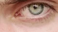 opening and closing of one eye of young man very sad - tears HD Footage